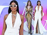 Naomi Campbell, 54, goes braless beneath a plunging white gown as she as she joins Elizabeth Hurley, 59, in an equally daring dress at star-studded V&A Summer Party