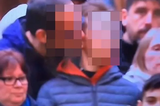 Police close probe into weird video of man nibbling boy's ear in snooker crowd