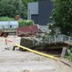 Flood water causing a river in Emilia-Romagna to burst its banks