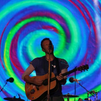 Coldplay perform on The Pyramid stage at Glastonbury. Pic: Reuters