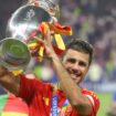 Rodri celebrates with the trophy after Spain won Euro 2024. Pic: AP
