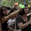 Angry mob of 'anti-tourism' protesters use water pistols to drench foreigners visitors at restaurants in Barcelona - as thousands march on Spanish capital and call for a tourists to 'go home'
