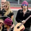 Johnny Depp seen looking cozy with mystery blonde woman while traveling out of London Heliport - two years after Amber Heard trial