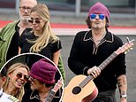 Johnny Depp seen looking cozy with mystery blonde woman while traveling out of London Heliport - two years after Amber Heard trial