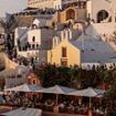 Locals' fury as Santorini council tells them to stay 'locked away' at home so 'tourists can wander free' on their tiny Greek island - as record number of 17,000 tourists descend in ONE day