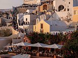 Locals' fury as Santorini council tells them to stay 'locked away' at home so 'tourists can wander free' on their tiny Greek island - as record number of 17,000 tourists descend in ONE day