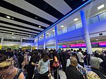Microsoft meltdown sparks travel chaos across the UK: Huge queues form at airports with Ryanair flights grounded while trains are also axed as passengers suffer delays across the country