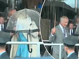 Moment King Charles snaps at an aide to help out after Queen Camilla struggled to get her coat on while battling wind and rain in Jersey