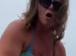Moment bellowing Karen tries to rope off areas of public BEACH outside her stunning California home while hurling abuse at shocked family