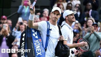 Andy Murray waves to the Wimbledon crowd as he walks out onto Centre Court