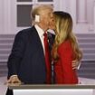 Sealed with a kiss: Melania and Donald share tender moment as family joins them on stage after former first lady broke with tradition... and one key member is missing