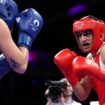 Olympic boxer who failed gender test wins quarterfinal bout, guaranteed medal