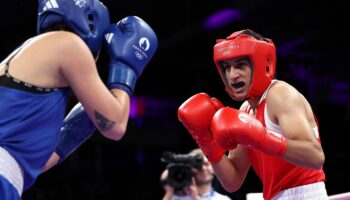 Olympic boxer who failed gender test wins quarterfinal bout, guaranteed medal