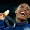 Simone Biles, of the United States, celebrates after winning the gold medal at the medal ceremony during the women's artistic gymnastics individual vault finals at Bercy Arena at the 2024 Summer Olympics, Saturday, Aug. 3, 2024, in Paris, France. (AP Photo/Francisco Seco)