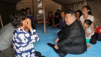 Kim visits a flood-hit area in Uiju. Pic: Korean Central News Agency/Korea News Service/AP