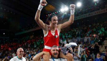 Imran Khelife celebrates after winning the fight. Pic: Reuters