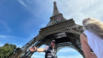 Video shows man climbing Eiffel Tower - prompting evacuation hours before closing ceremony