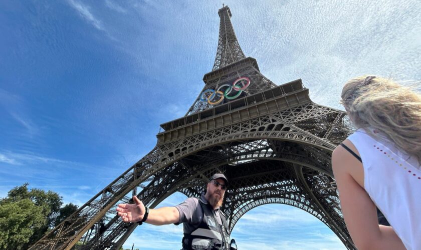 Video shows man climbing Eiffel Tower - prompting evacuation hours before closing ceremony