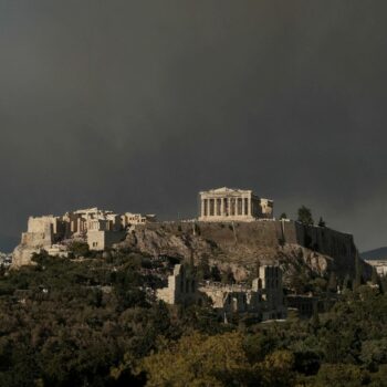 The Parthenon temple atop the Acropolis hill as smoke from a wildfire is seen, in Athens Greece, August 11, 2024. REUTERS/Elias Marcou TPX IMAGES OF THE DAY