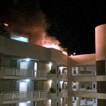 The fire burning on the DoubleTree Hotel after the helicopter crash. Pic: Reuters