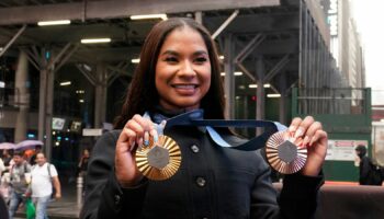 Jordan Chiles shows off her gold and bronze medals in New York. Pic: AP