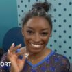 Simone Biles shows off her goat necklace