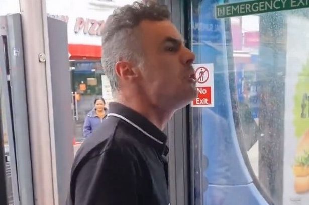 Moment yob hurls disgusting racist abuse and spits at Muslim bus driver