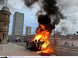 Police station firebombed as rioting explodes in Sunderland: Mobs of masked thugs ransack cop HQ, flip and torch car and surround a mosque - in fresh night of violence after Southport stabbings