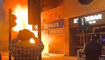 Sunderland police station set on fire as rioters hurl beer barrels at police