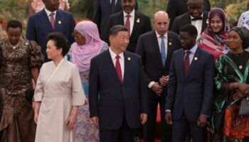 China's President Xi Jinping and his wife Peng Liyuan get ready to pose for a group photo together with leaders from African countries before a welcome dinner at the Forum on China-Africa Cooperation (FOCAC)