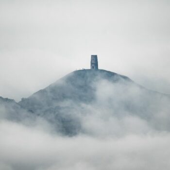 People gather on Glastonbury Tor after heavy rain over the Somerset Levels on Saturday. Pic: PA