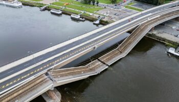 Parts of the Carola Bridge over the Elbe have collapsed in Dresden, Germany, Wednesday, Sept. 11, 2024. (Robert Michael/dpa via AP)