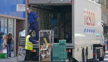 A delivery lorry outside a Tesco Express store in central London. Pressure is mounting on the Government to bring forward the date at which people who are double vaccinated against coronavirus can avoid self-isolation as emergency measures to protect food supplies were launched on Thursday. Picture date: Friday July 23, 2021.