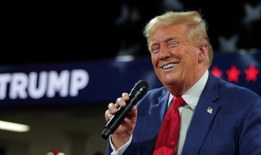 Republican presidential nominee and former U.S. President Donald Trump holds a campaign town hall meeting, moderated by Arkansas Governor Sarah Huckabee Sanders, in Flint, Michigan, U.S., September 17, 2024. REUTERS/Brian Snyder