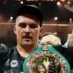 Oleksandr Usyk celebrates with the undisputed heavyweight title belt after his victory