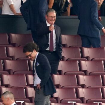 Sir Keir Starmer in the stands ahead of the Manchester United v Arsenal match at Old Trafford in May. Pic: PA