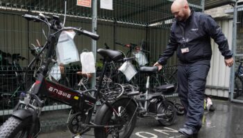 Sergeant Chris Hook handles confiscated illegally modified ebikes at Bishopsgate Police Station in London. Police seizures of illegally modified electric bikes (e-bikes) soared in the past year amid concerns their speed and weight present a lethal threat to pedestrians, according to Freedom of Information (FoI) figures obtained by the PA news agency. Forces across the UK confiscated 937 e-bikes in the year to August 11. Picture date: Thursday September 12, 2024.