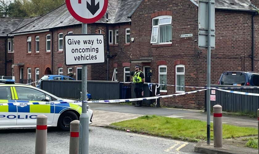 The scene in Salford where a 40-year-old woman and an eight-year-old girl have both been found dead inside a property