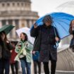 Umbrellas amid wind and rain in London on Friday. Pic: PA