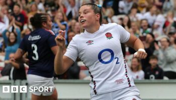 Jess Breach celebrates after scoring a try against France