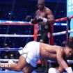 Anthony Joshua hits the canvas with Daniel Dubois over him