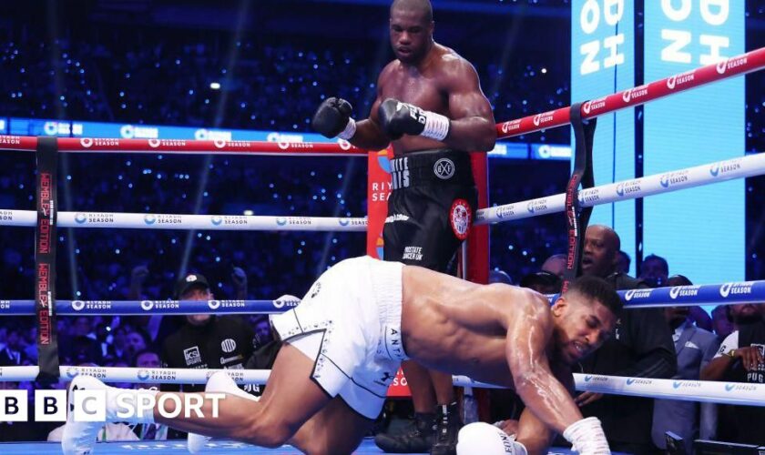 Anthony Joshua hits the canvas with Daniel Dubois over him