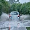 Dozens of flood alerts issued as heavy rain causes travel chaos across large parts of Britain - with railway lines shut from the deluge