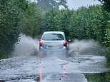 Dozens of flood alerts issued as heavy rain causes travel chaos across large parts of Britain - with railway lines shut from the deluge