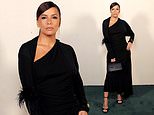 Eva Longoria flaunts her curves in an elegant draped black gown as she attends pal Victoria Beckham's runway show at Paris Fashion Week