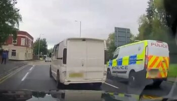 Harrowing moment police van slams into elderly woman in her 80s crossing the road