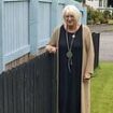 It's fence wars! Feuding neighbours build rival wooden barriers between their gardens after falling out over a lawnmower and hedge trimming