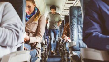 Manspreading fury after female passenger left pinned in seat on two-hour flight