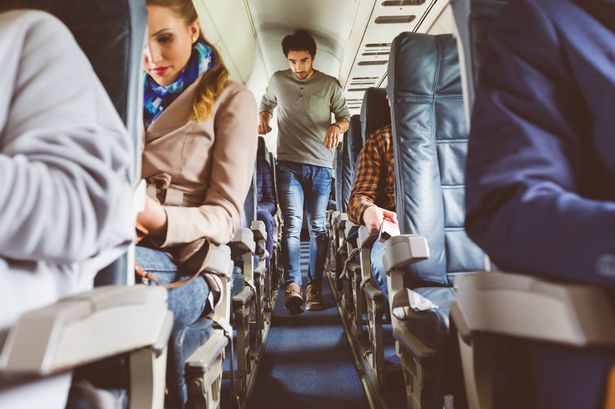 Manspreading fury after female passenger left pinned in seat on two-hour flight