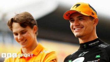 Lando Norris of Great Britain and McLaren smiles with team mate Oscar Piastri of Australia